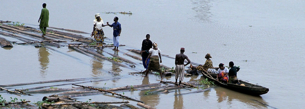 People traveling on rafts and boats in Nigeria.