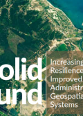 A satellite image of a village in a grassy area. Superimposed on top are the words solid ground: increasing community resilience through improved land administration and geospatial information systems