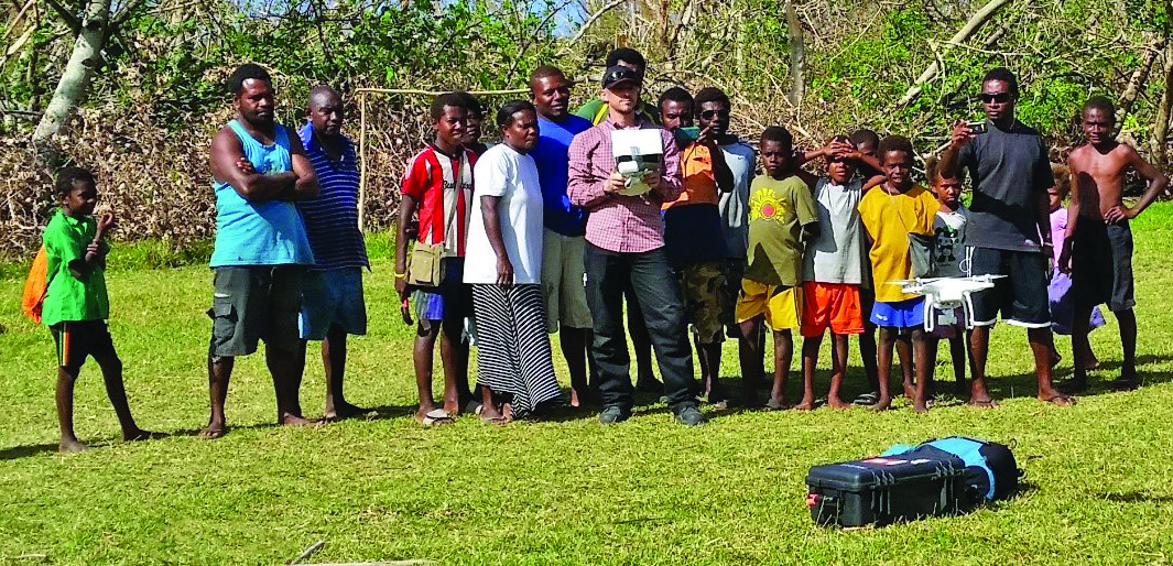 Man uses a UAV to collect risk information in Tonga