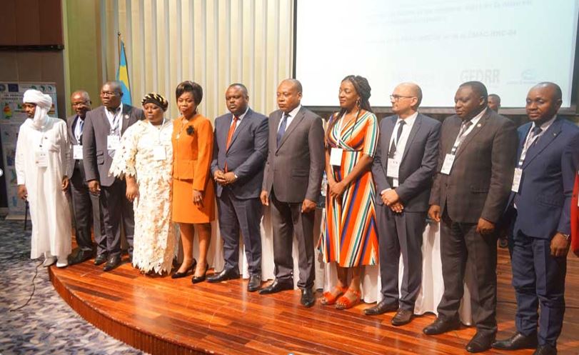 A group of ministers standing on a stage