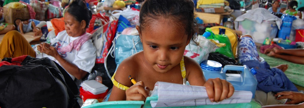 A young girl staying at an evacuation center in the Philippines.