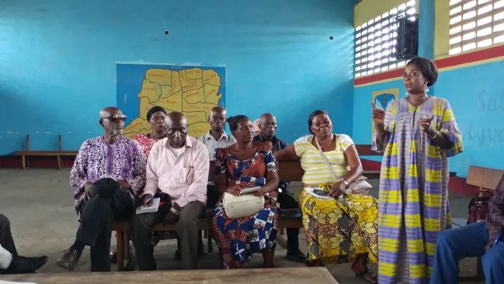 President of Delapaix neighborhood Ms. Pay Pay describes flooding issues at a community engagement event in Kinshasa, Democratic Republic of Congo.