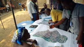 Members of the mapping community in Kinshasa, DR Congo plan the collection of field data for the Kisenso neighborhood. (Courtesy of OpenDRI)