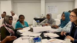 Professor Tiziana Rosetto of University College of London talks with some women from Sri Lanka.
