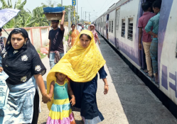 Commuters walking in train platform after disembarking from on a hot summer day. Photo: ©Suprabhat Dutta